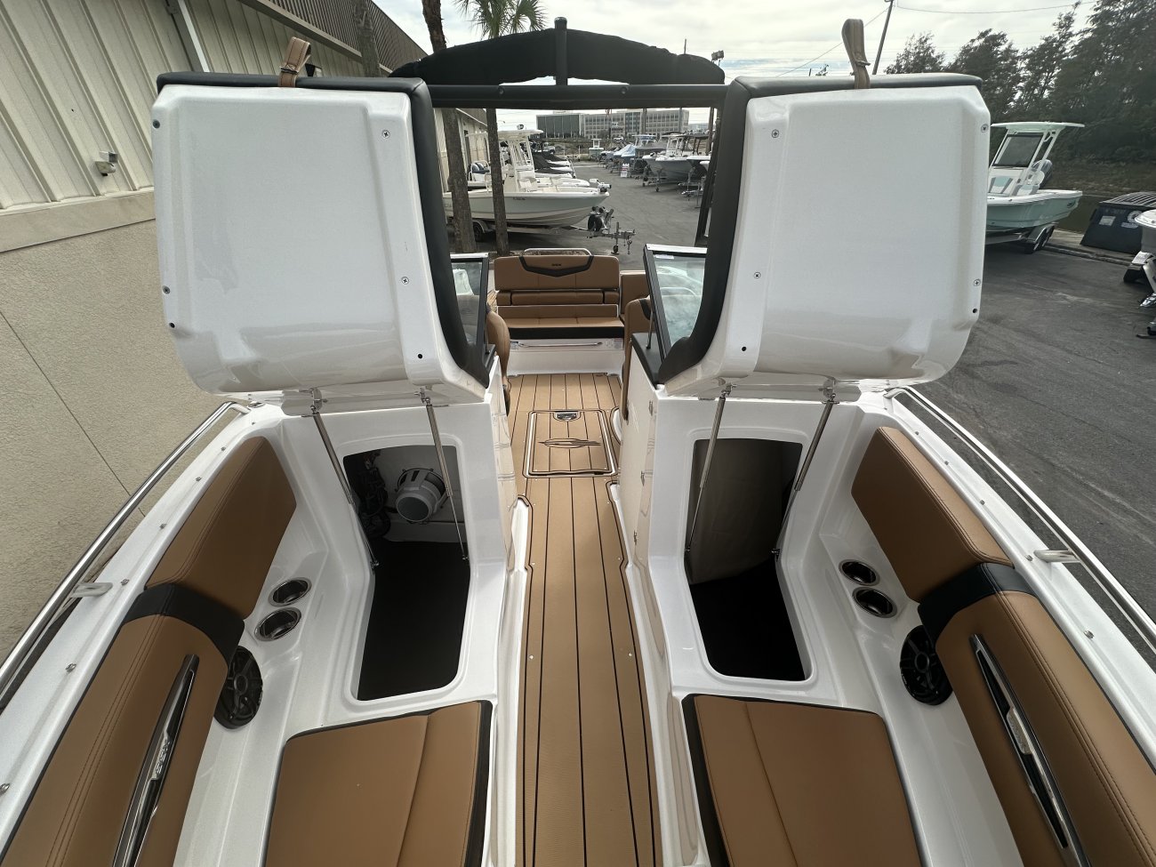A dual console boat is typically one that was designed for salt water fishing and has the console split around a center walk thru to the bow.  The helm is usually starboard while there is passenger seating to port.