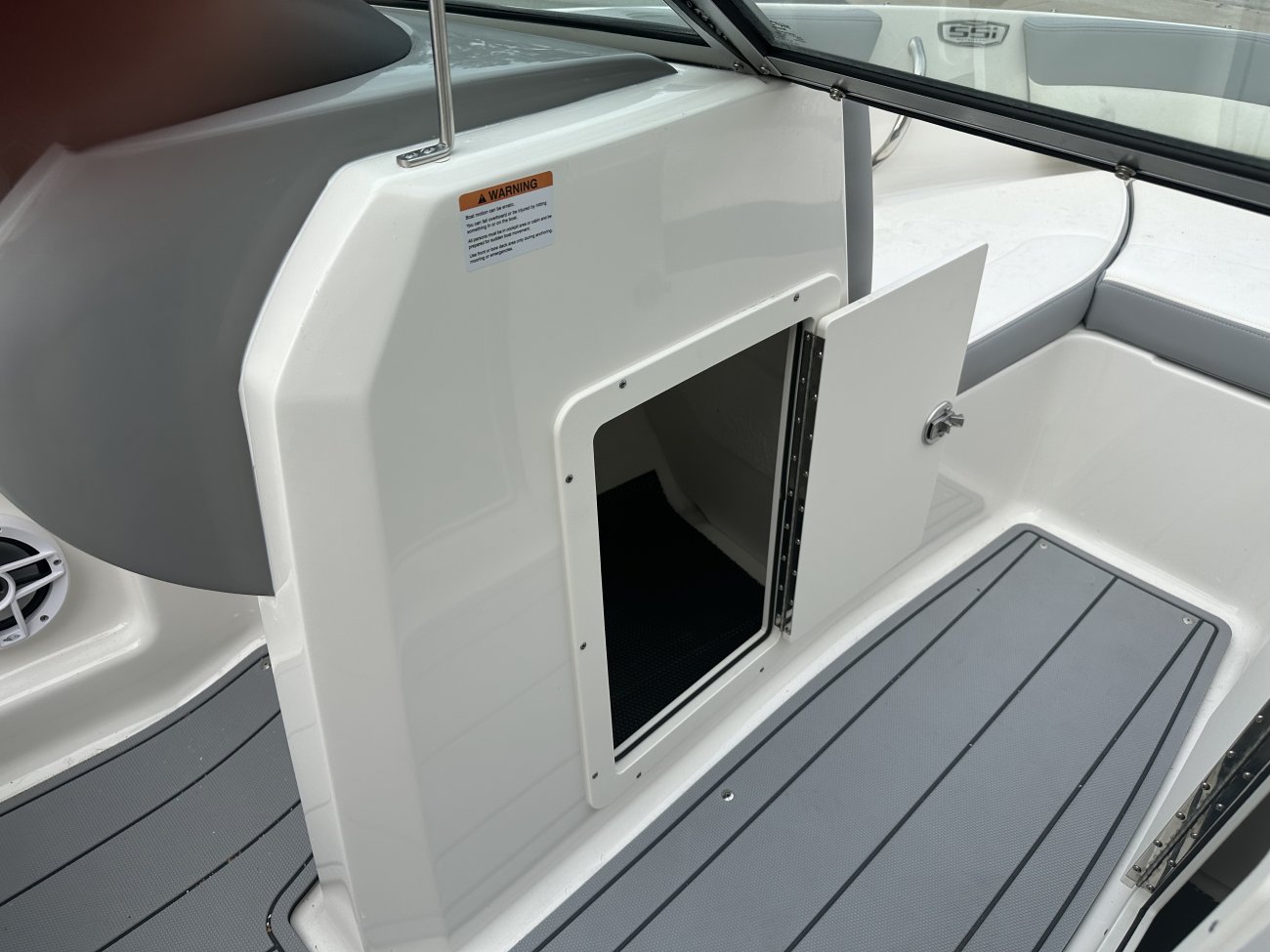 The deckboat is a cross between a bowrider and a pontoon boat.  It features a rather flat deck area with lots of room for people while still offering the speed and agility of a runabout.